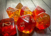 CHESSEX - Dados Poliédricos Gemini Translucent Red-Yellow/Gold - Gamesmart